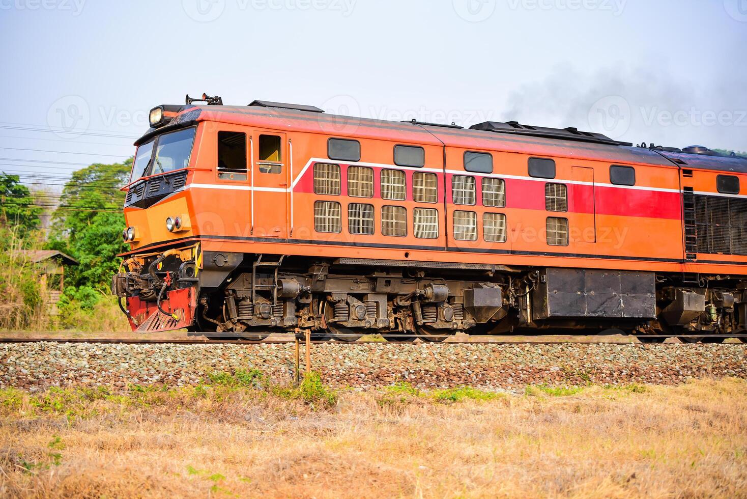 Old Thai-style trains that can still pick-up passengers on the train tracks photo