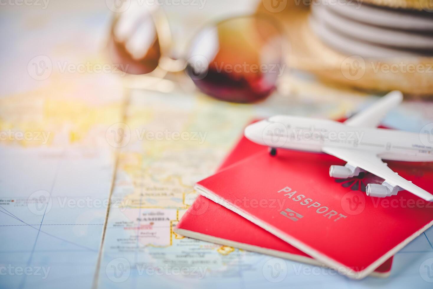 Passport placed on the map concept tourism planning and equipment needed for the trip photo