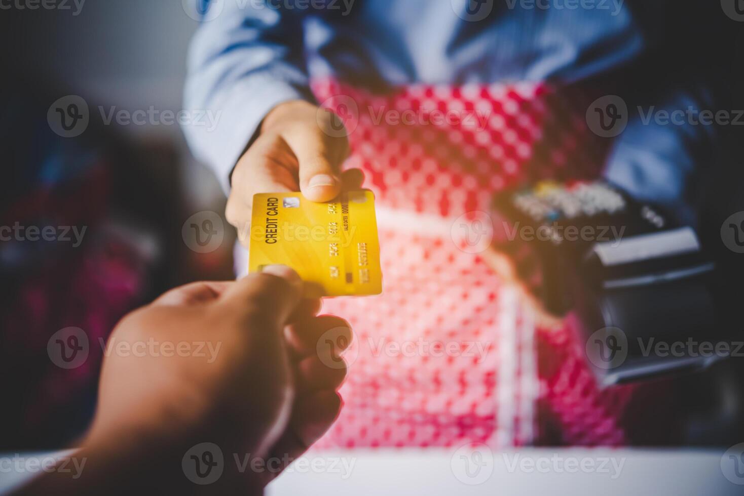 Paying by credit card , buying and selling products using a credit card swipe machine photo