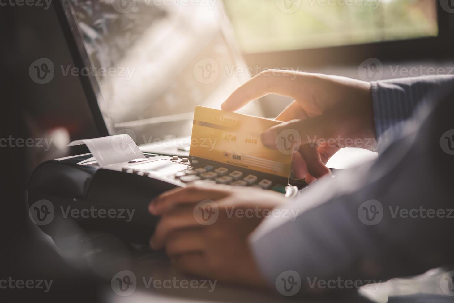 Paying by credit card , buying and selling products using a credit card swipe machine photo