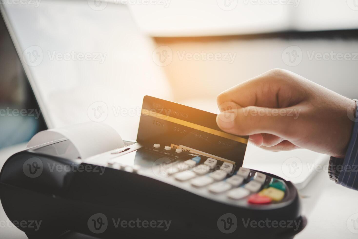 Paying by credit card , buying and selling products using a credit card swipe machine photo