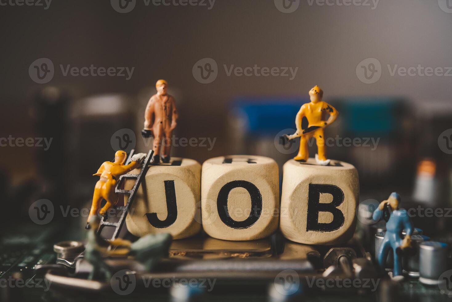 Miniature people or small figure worker on wood block with the word job. Working for an organization concept. photo