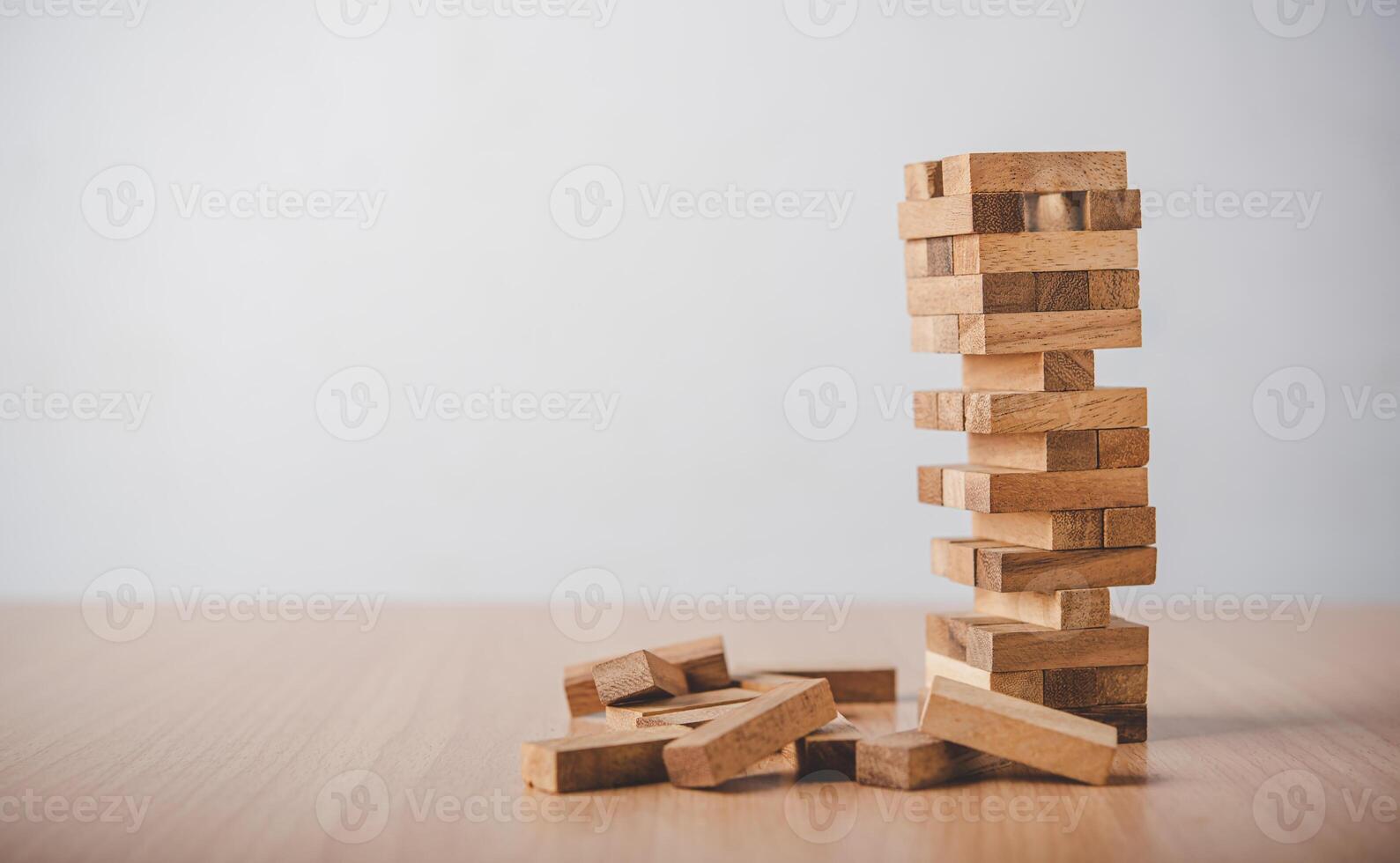 game drew to a wooden block from the tower.concept  business risks in the business. Requires planning meditation must be careful in deciding to reduce the risk in the business. photo