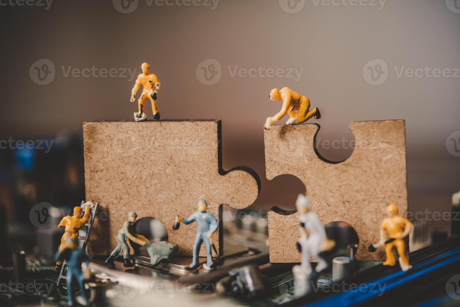 Miniature people or small figure worker on puzzles to connect. Ideas about building a business network concept. photo