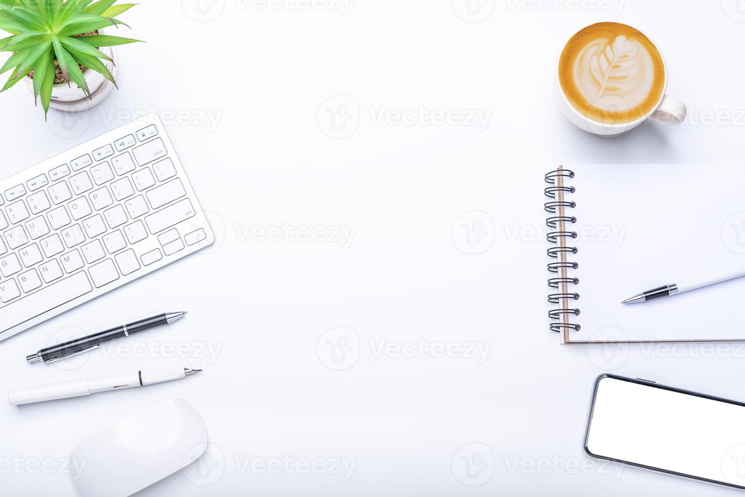 Top view with working desk with laptop,cellphone,notebook pencil coffee cup and eyeglasses in the office. photo