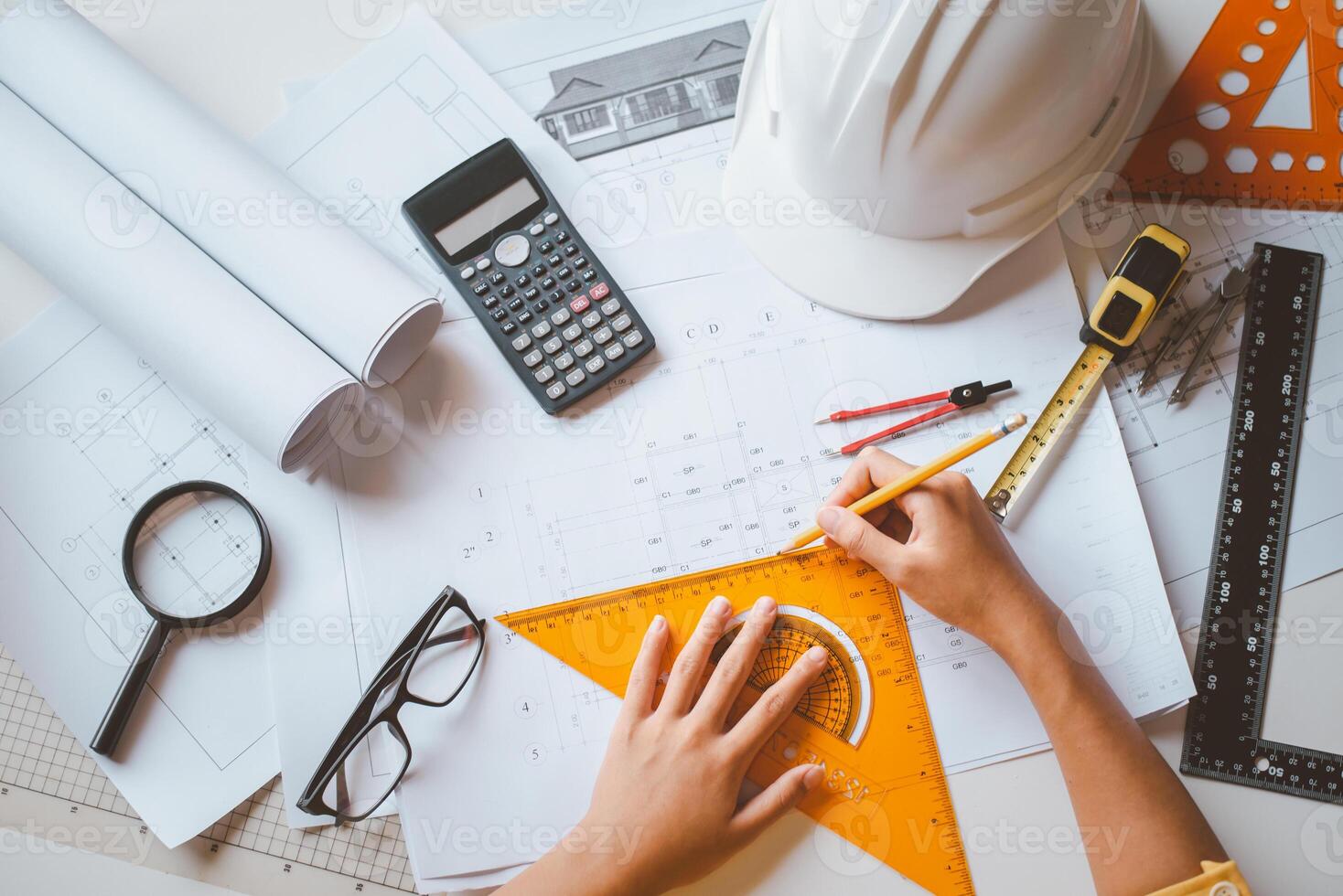 engineer working in office with blueprints, inspection in workplace for architectural plan, construction project ,Business construction photo