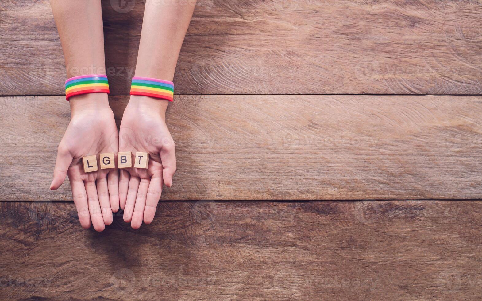 Block with the word LGBT in the hands. Gay rights fight. Gay pride LGBT concept photo