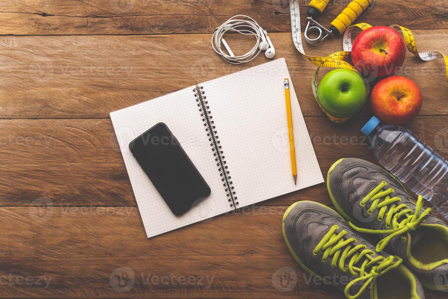 fitness concept with Exercise Equipment on wooden background. photo