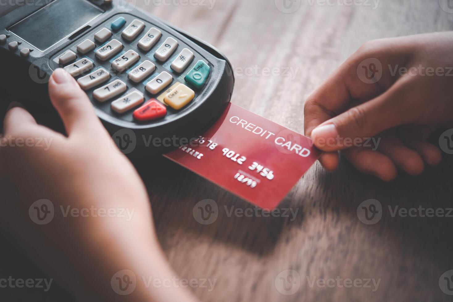 Paying by credit card, buying and selling products using a credit card swipe machine for convenience and speed, including online shopping photo