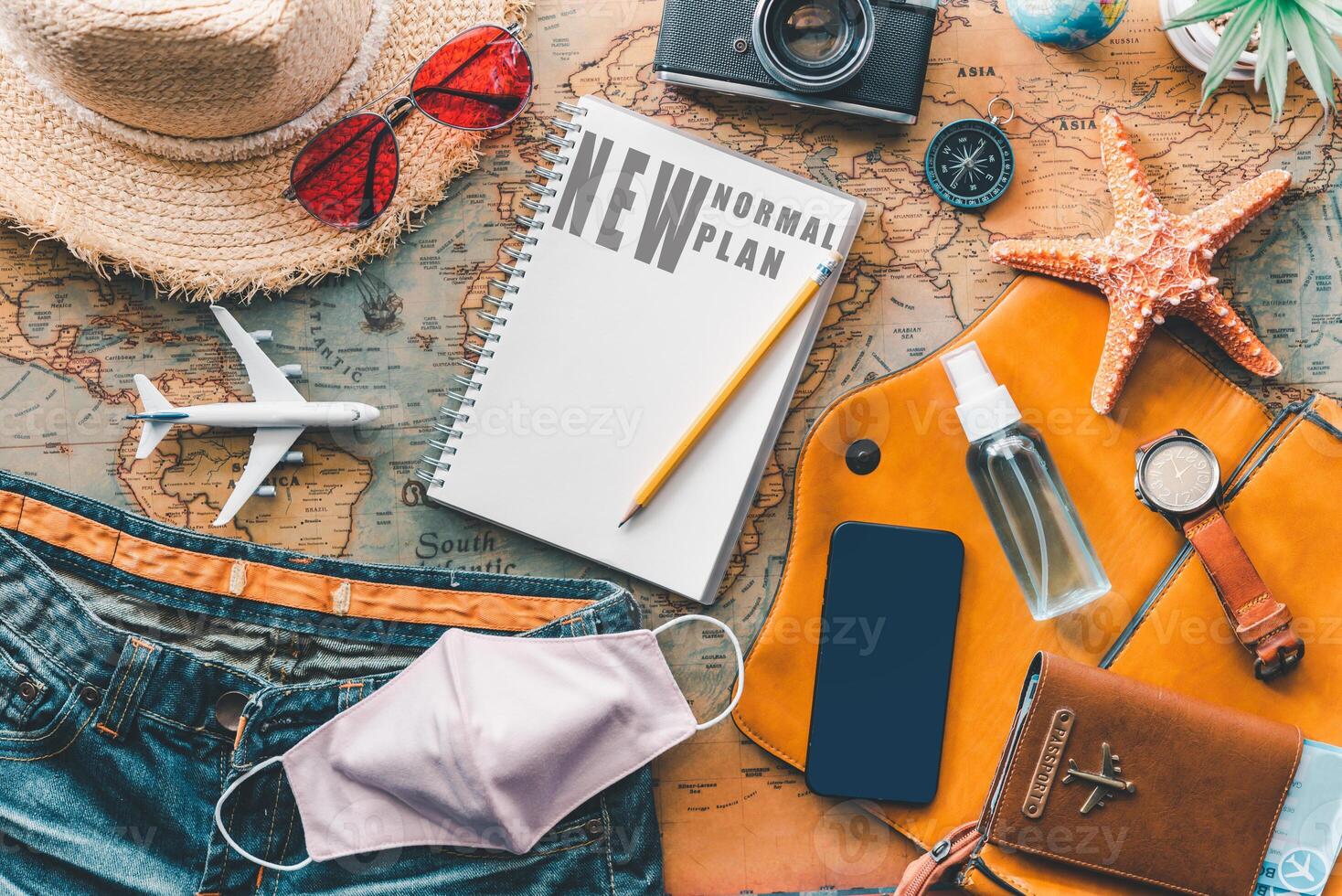 Protecting COVID-19 while Traveling. Travel accessories costumes. Passports, luggage, The cost of travel maps prepared for the trip .concept new normal lifestyle photo