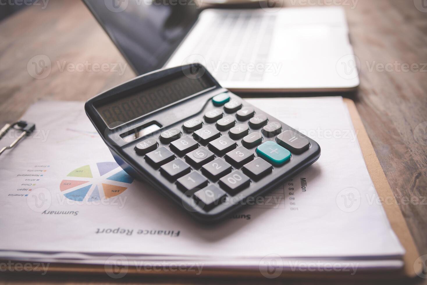close-up calculator on graph documents, device for calculating the numbers photo