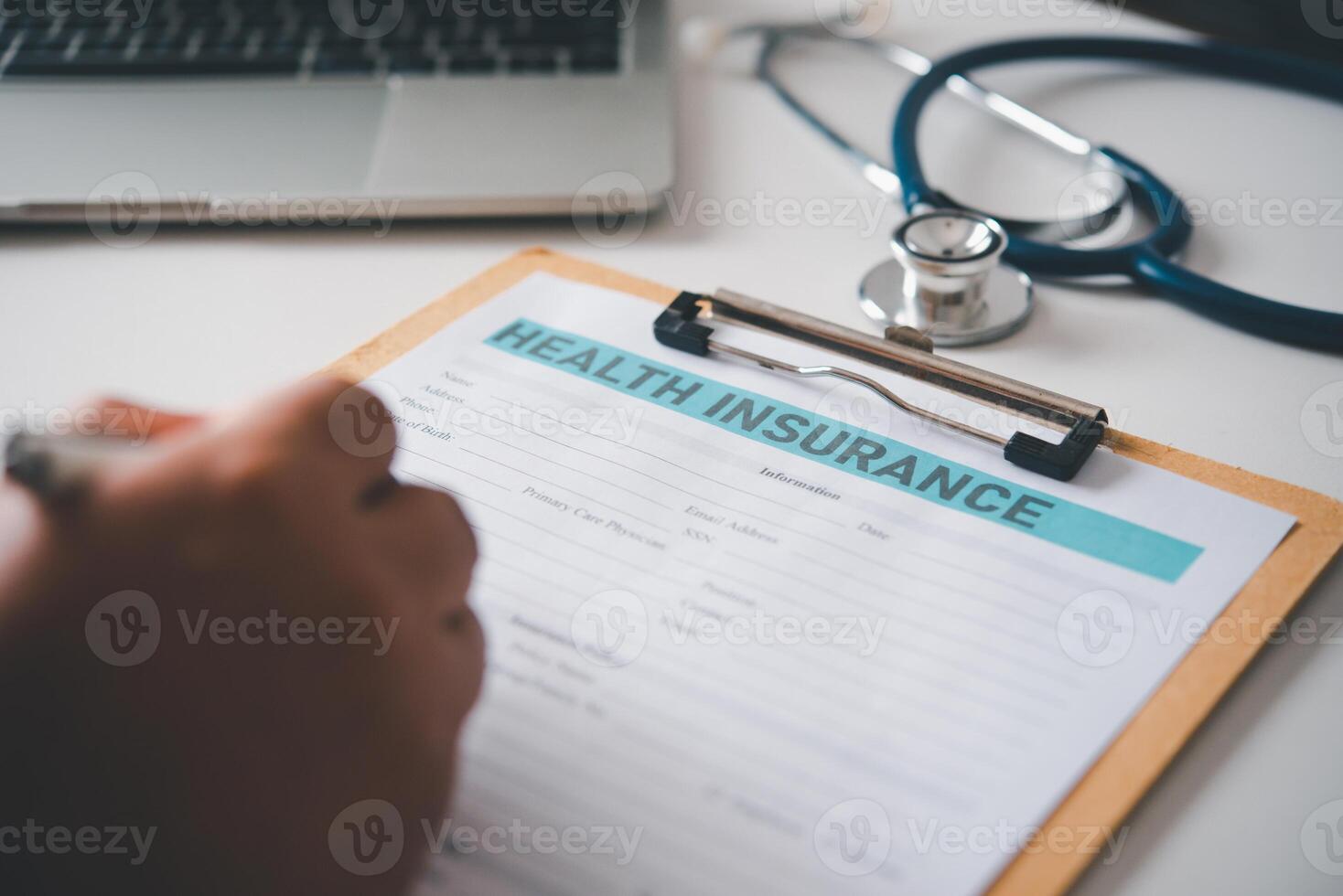 Health insurance documents with hand filling out life insurance, Individual medical health insurance, concept life planning photo