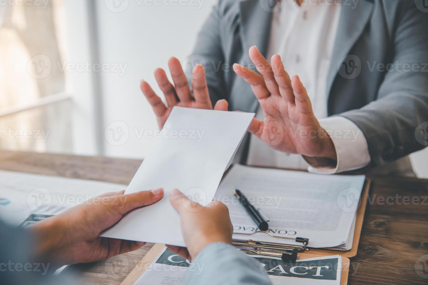 Businessmen refuse to accept dollar bills as a bribe for fraud. anti bribery and corruption concepts photo