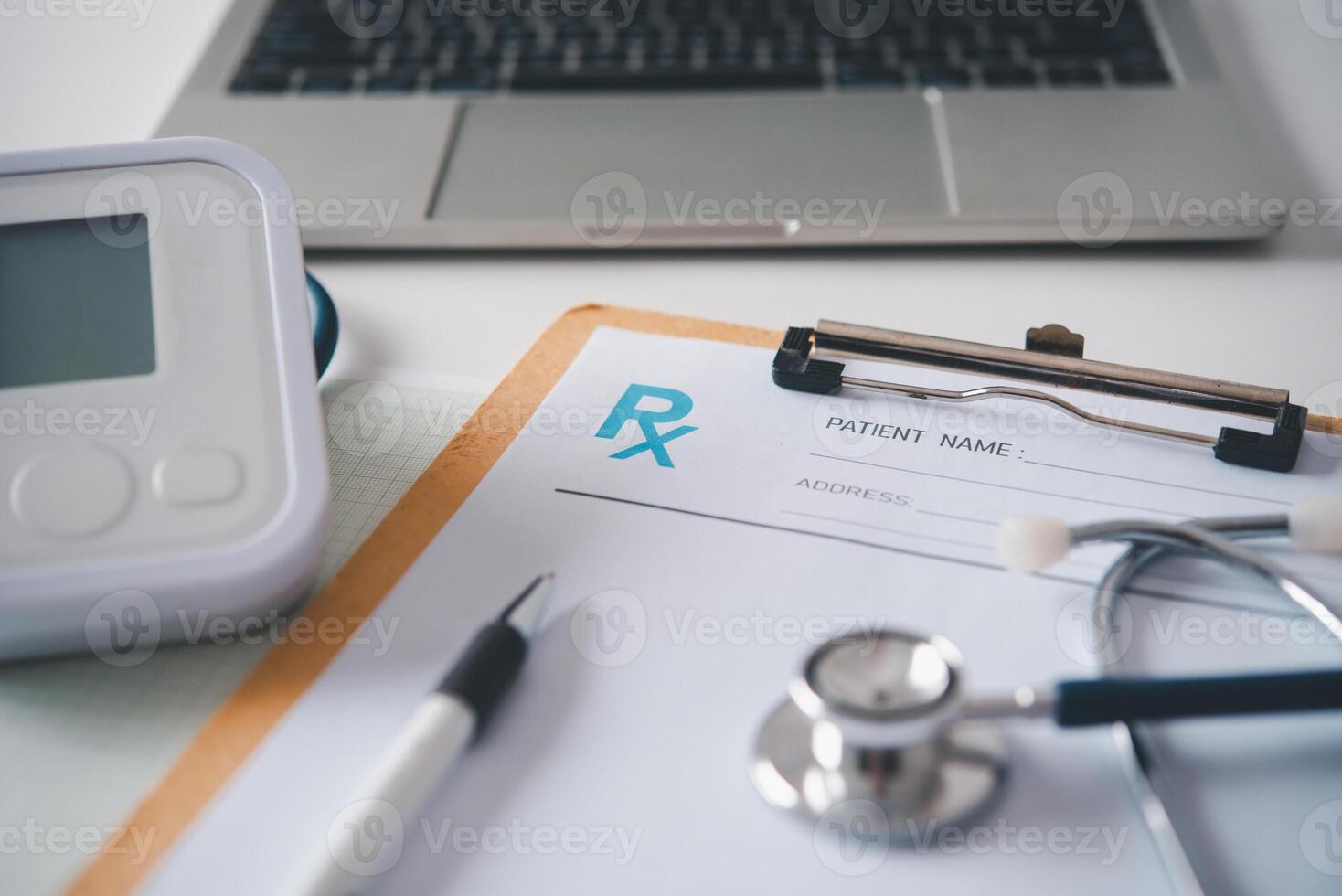 Rx blank with stethoscope resting on a doctor's desk photo