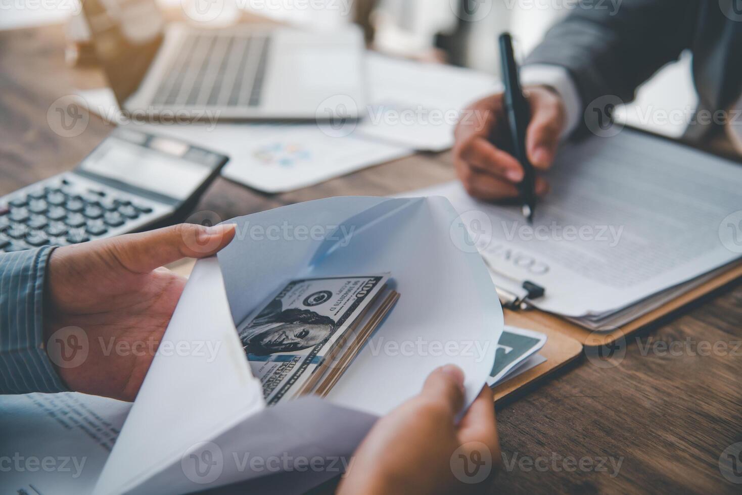 businessman was negotiating an agreement in which the dollar was accepted as a bribe in corruption. anti bribery and corruption concepts photo