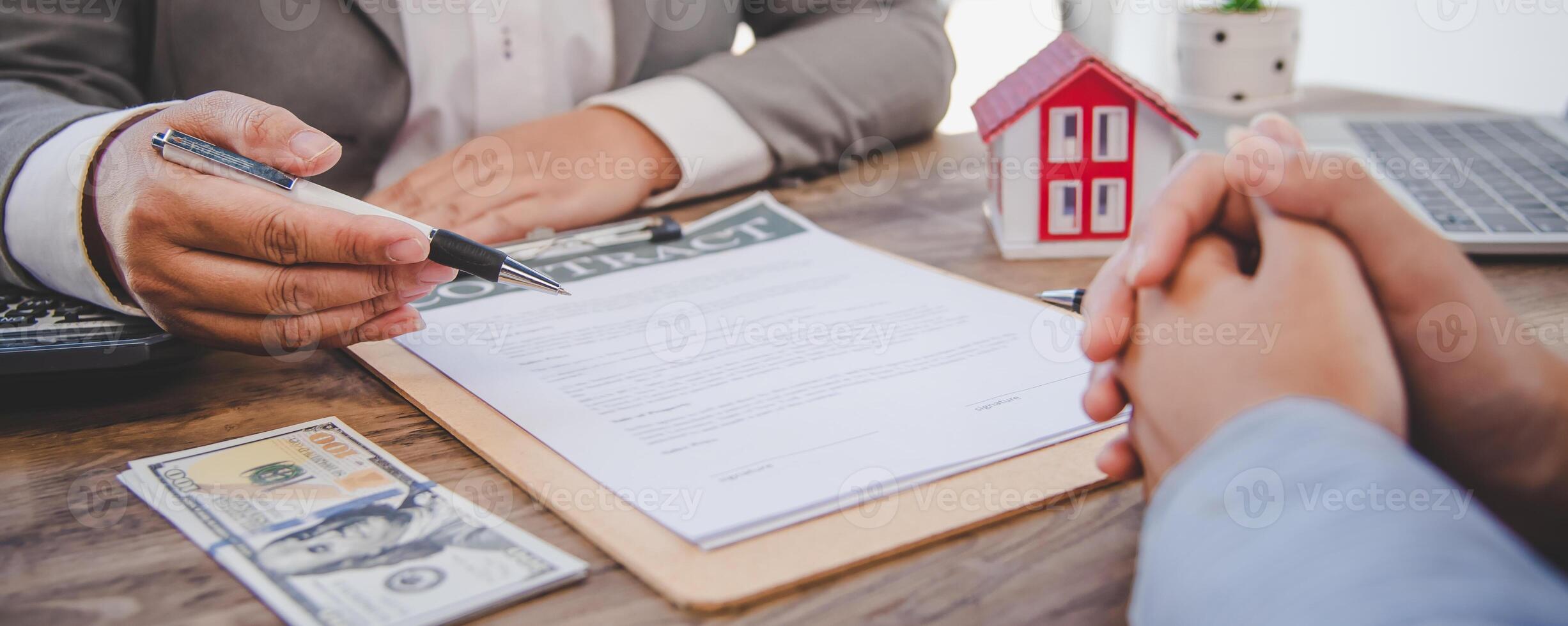 House signers signing signature loan document to home ownership with real estate agents ownership. Mortgage and real estate property investment, home insurance photo