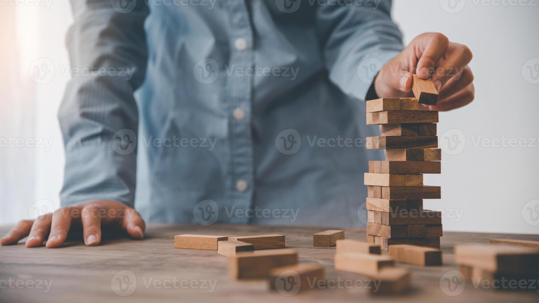 Business risks in the business. Requires planning Meditation must be careful in deciding to reduce the risk in the business. As the game drew to a wooden block from the tower photo