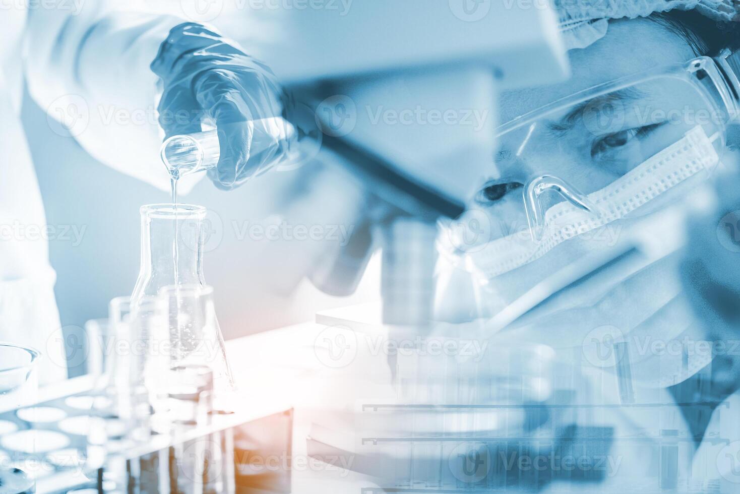 Scientists hold in vitro experiments with scientific instruments and laboratory microscope. - Experimental concept of research and development in medicine photo
