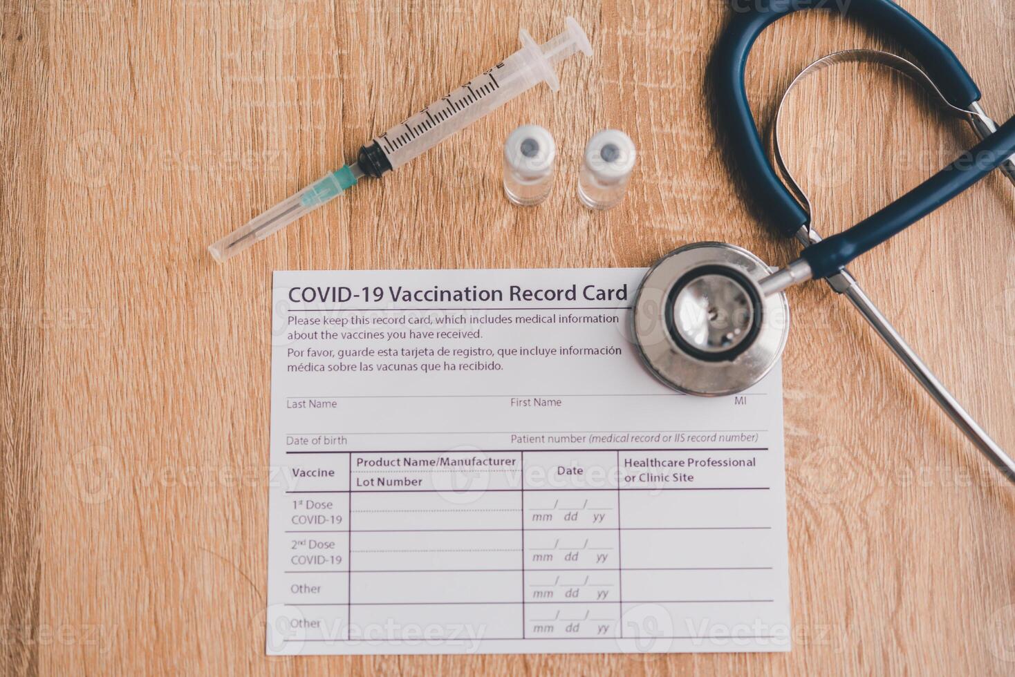 floor with a vaccine syringe and a stethoscope.patient who has already been vaccinated with Coronavirus .Coronavirus prevention photo