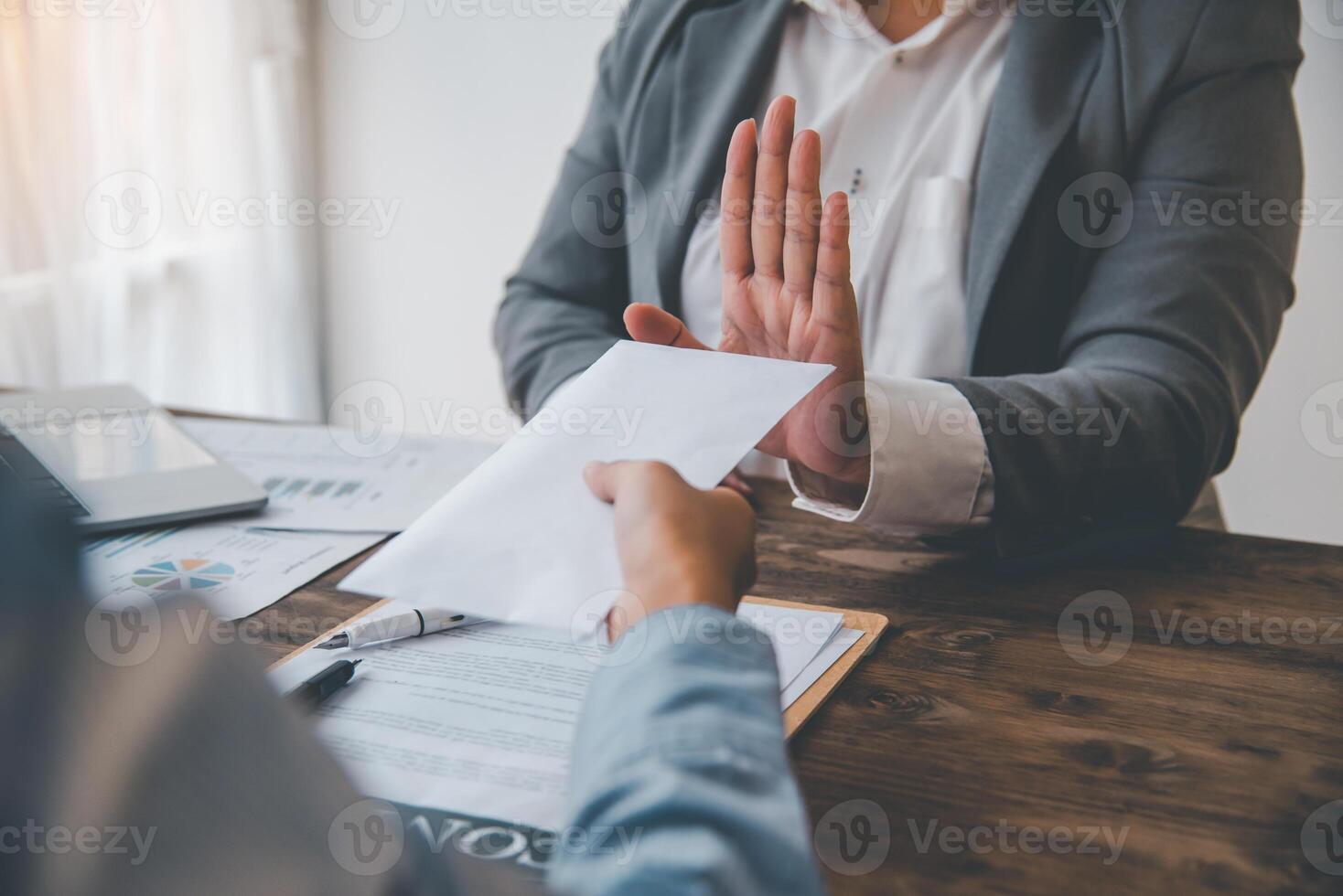 Businessmen refuse to accept dollar bills as a bribe for fraud. anti bribery and corruption concepts photo