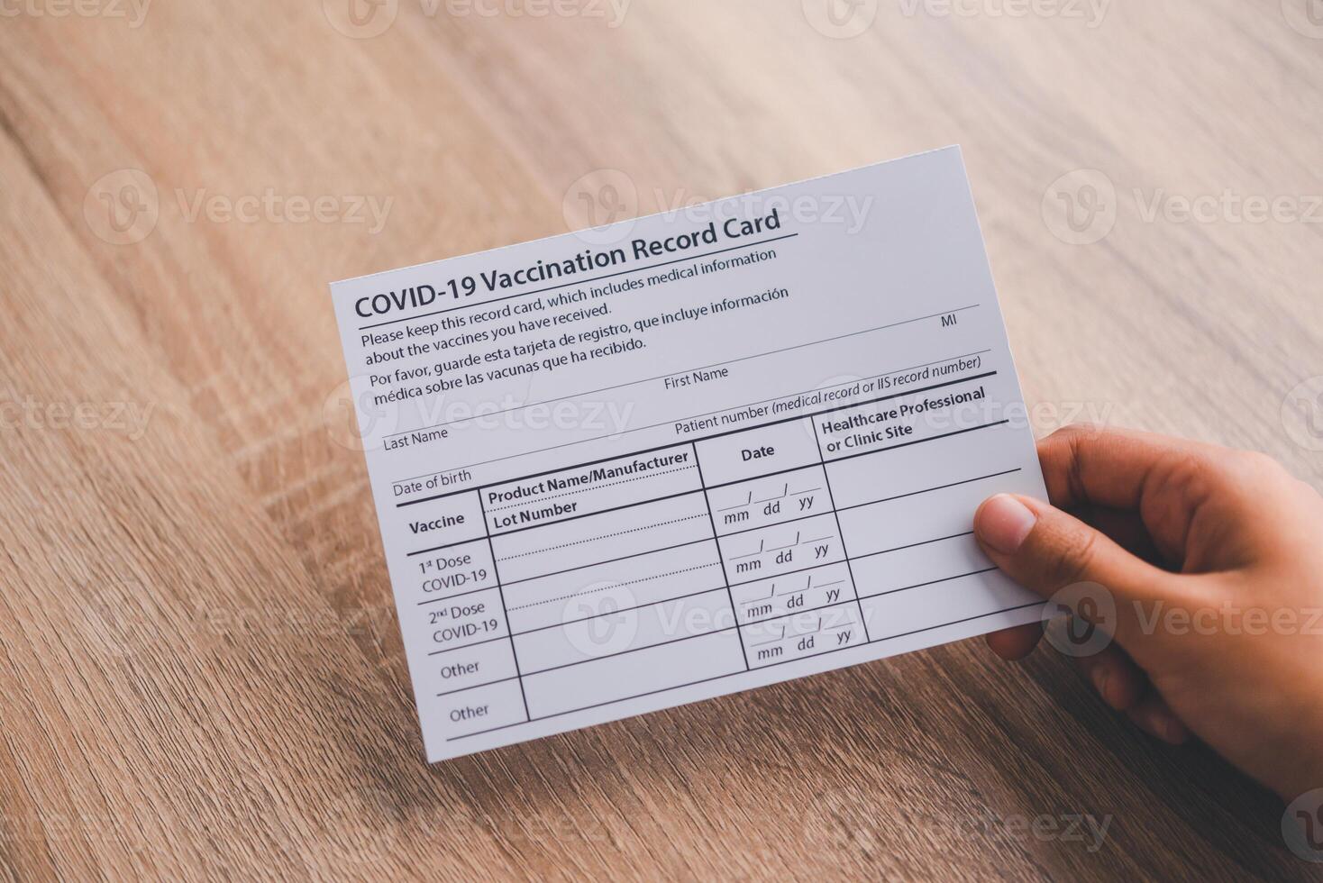 Coronavirus vaccination record card is held in hand. patient who has already been vaccinated with Coronavirus .Coronavirus prevention photo