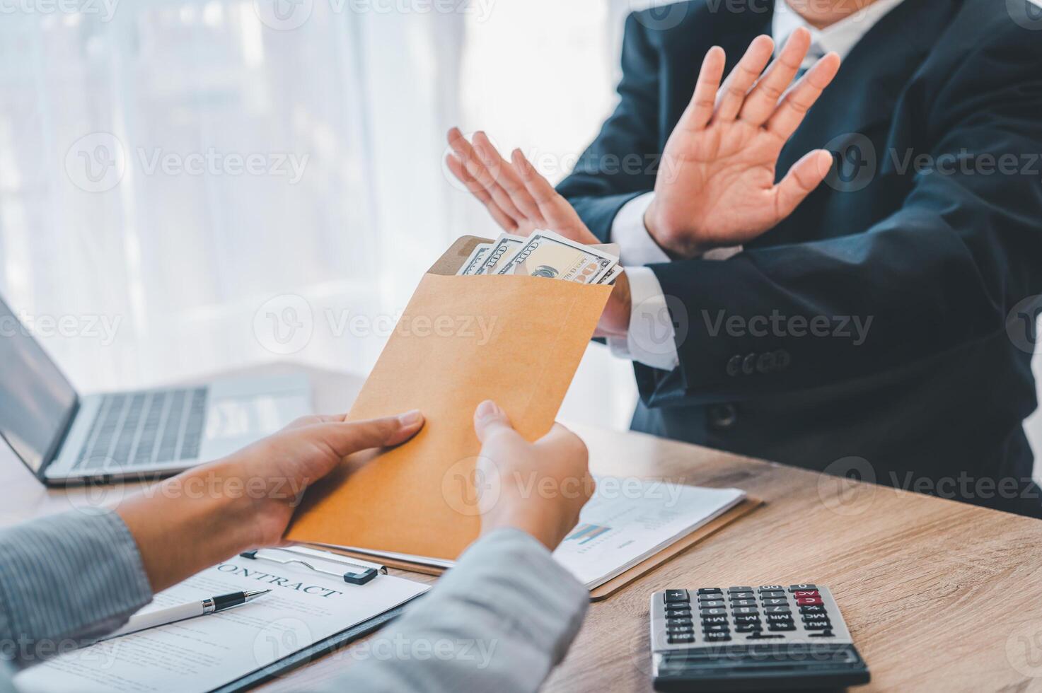 Dollar bills are not accepted as bribes by businesspeople. Concepts of anti-bribery and anti-corruption photo
