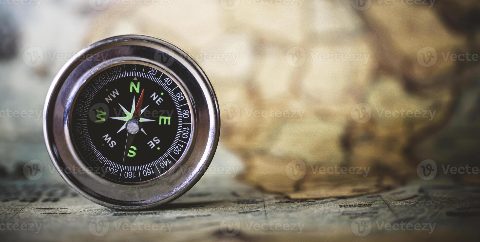 magnetic compass is placed on the map. Travel Ideas or Success photo