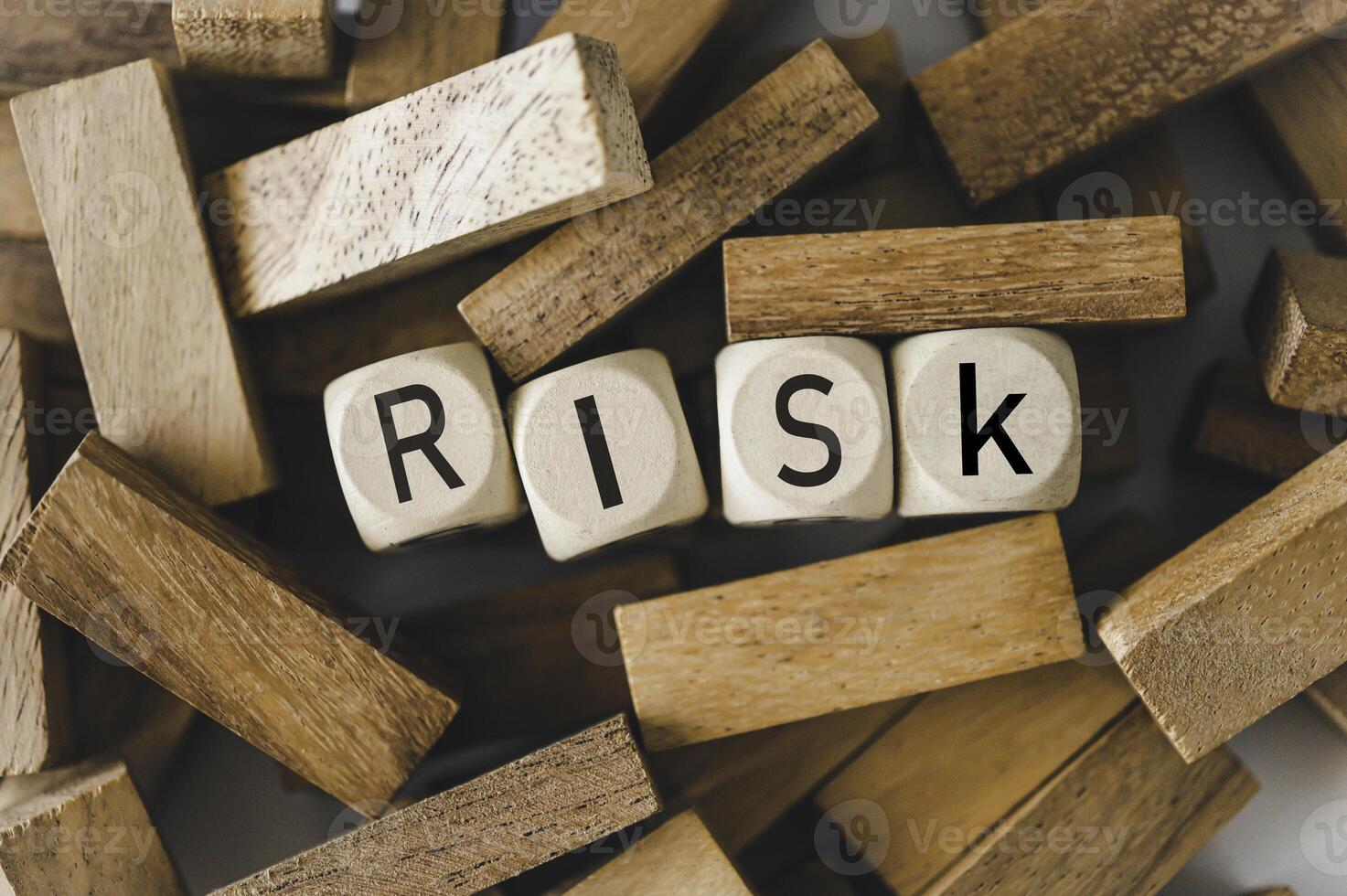 wooden block with the word RISK Concept risk photo
