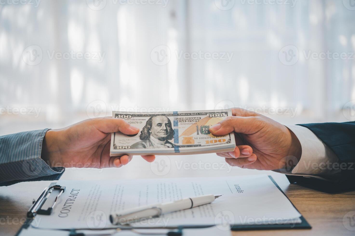 businessman was negotiating a bribery arrangement in which the dollar would be accepted as a bribe. Concepts of anti-bribery and anti-corruption photo