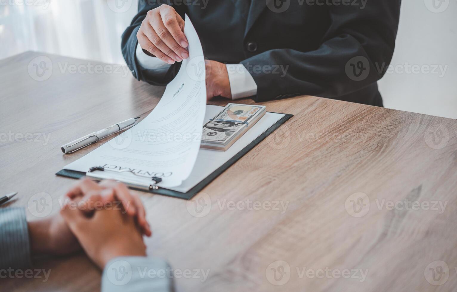 businessman was negotiating a bribery arrangement in which the dollar would be accepted as a bribe. Concepts of anti-bribery and anti-corruption photo