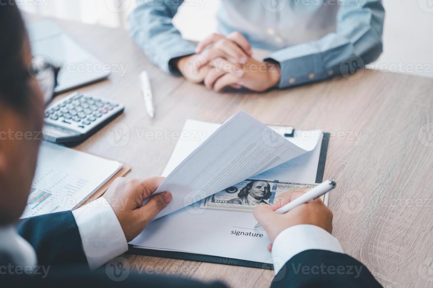 businessman was negotiating a bribery arrangement in which the dollar would be accepted as a bribe. Concepts of anti-bribery and anti-corruption photo
