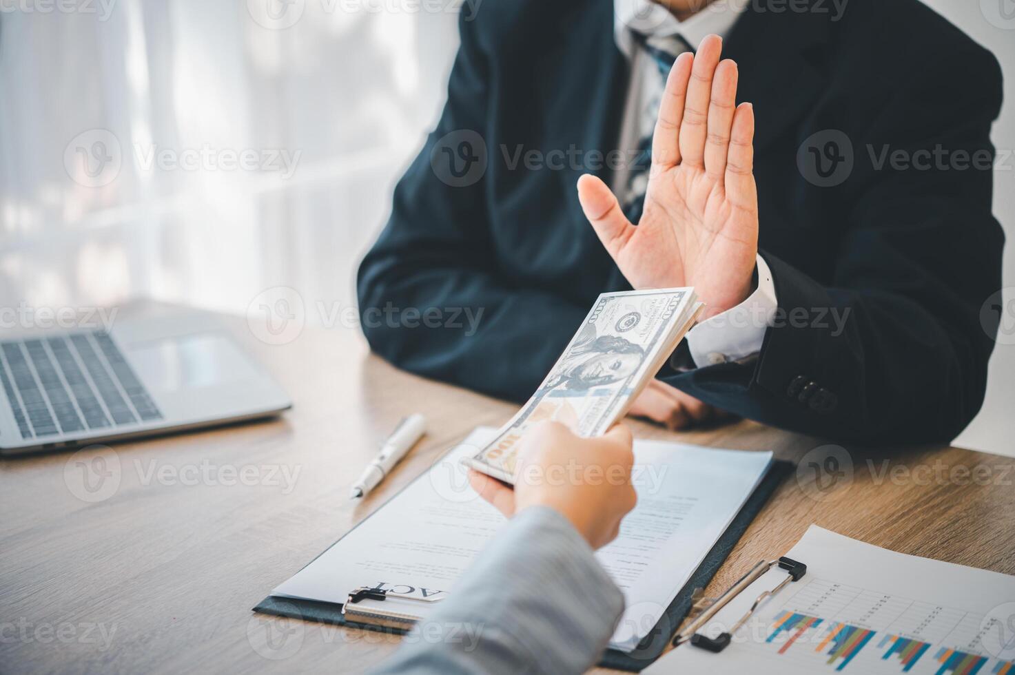 Dollar bills are not accepted as bribes by businesspeople. Concepts of anti-bribery and anti-corruption photo