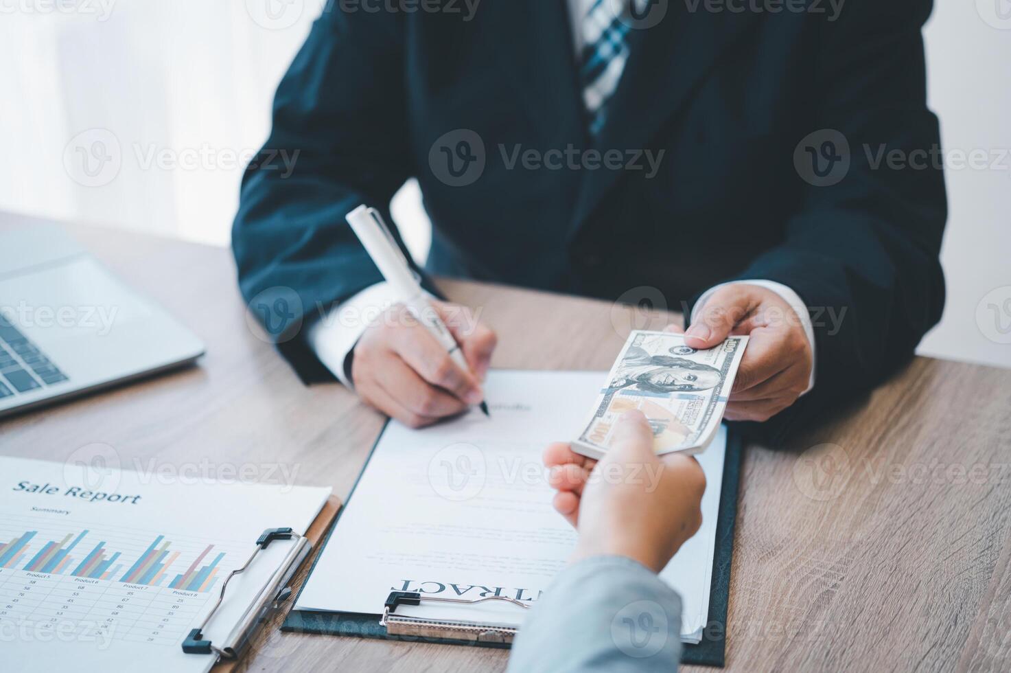 businessman was negotiating a bribery arrangement in which the dollar would be accepted as a bribe. Concepts of anti-bribery and anti-corruption photo