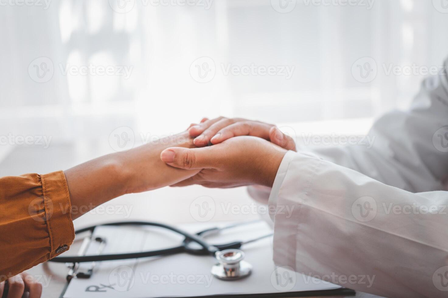 Close-up of the psychiatrist's hand holding the patient's hand. To encourage and comfort the patient photo