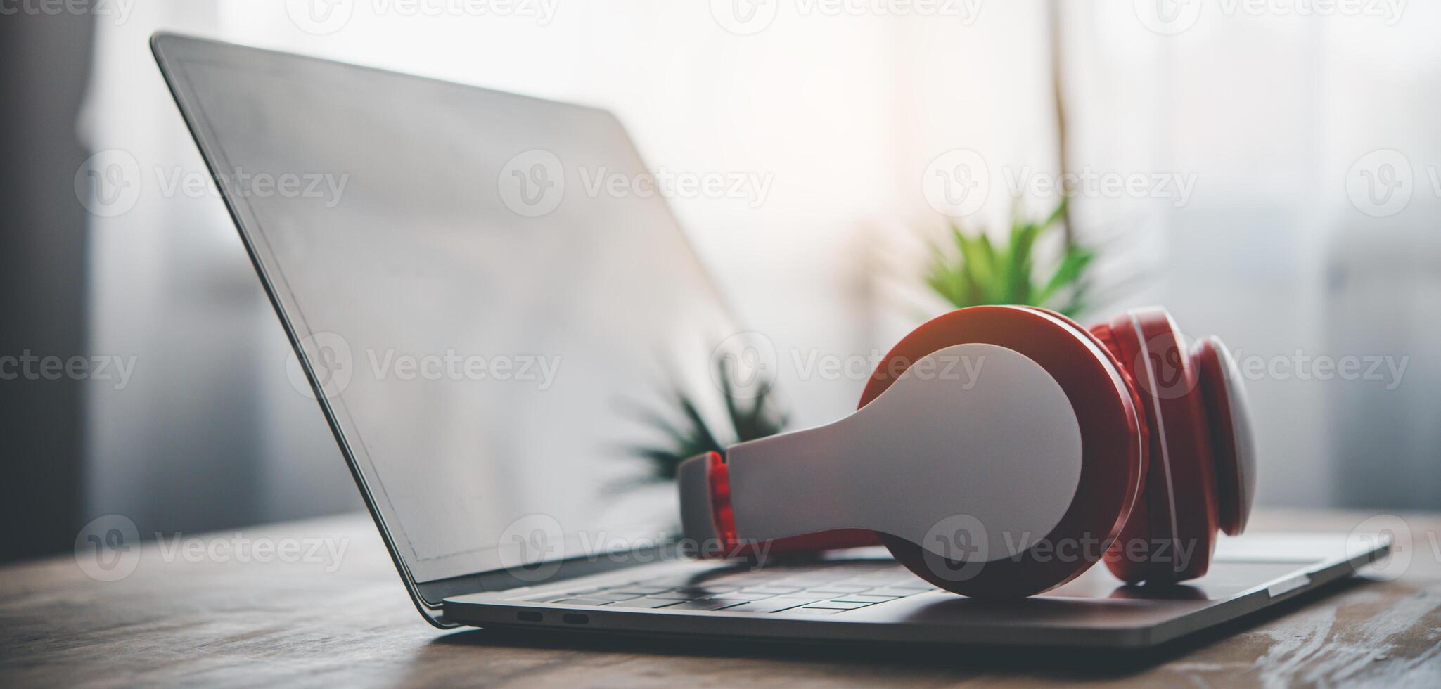 headphones are on a laptop, on the desk. Concepts of music for relaxation photo