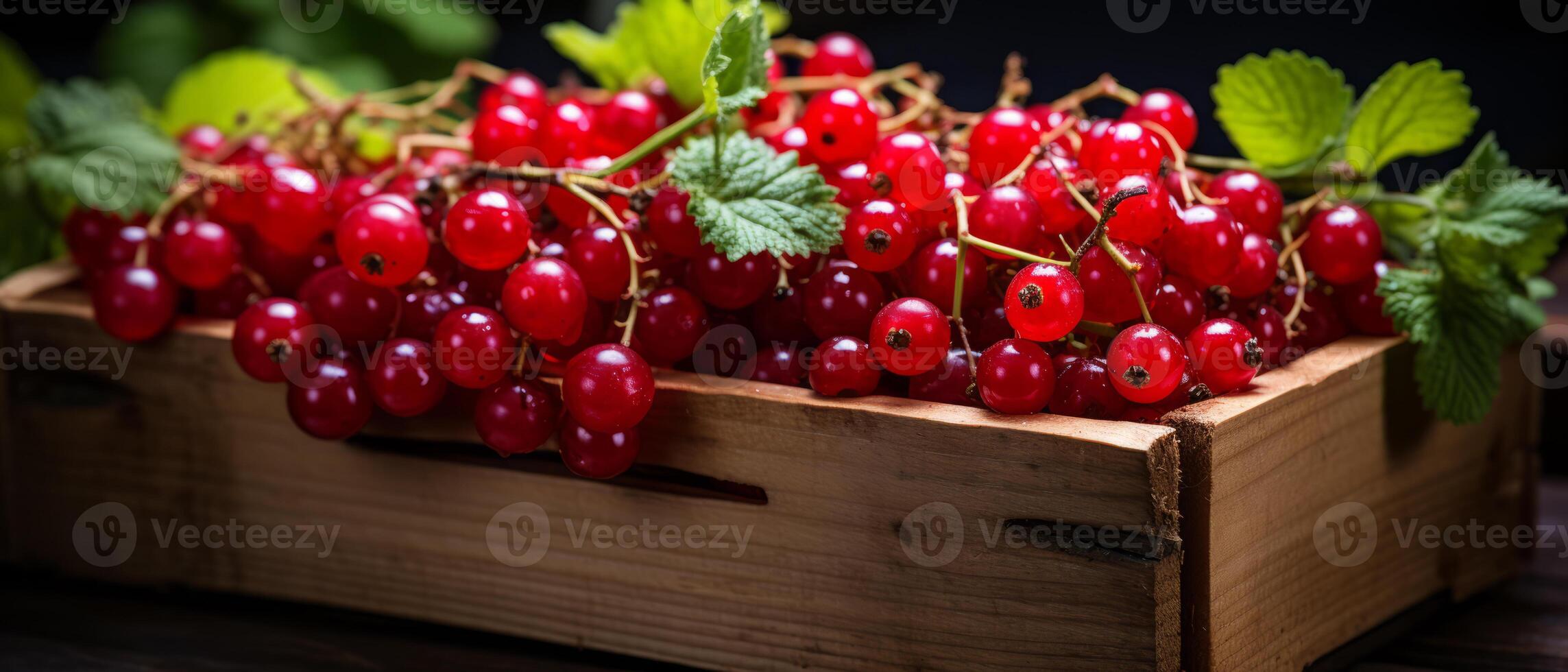 AI generated Vibrant red currants in a wooden crate against a dark background. photo