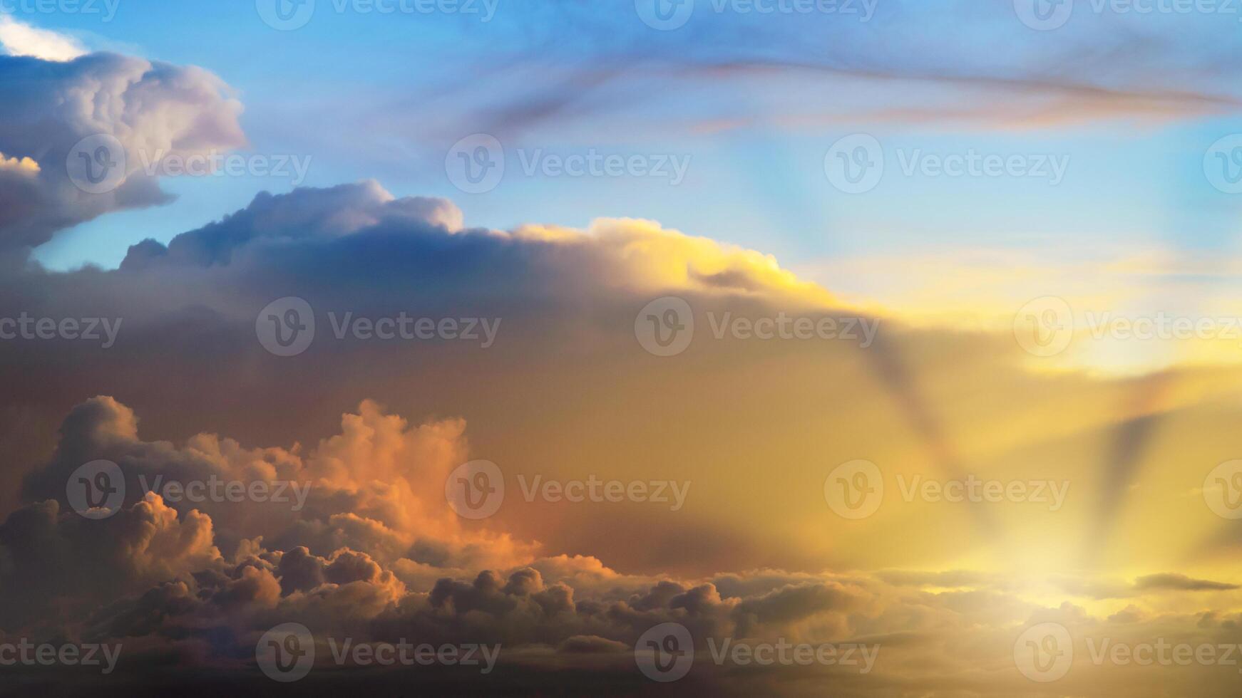 Rays of light shining through clouds, dramatic sky with cloud photo