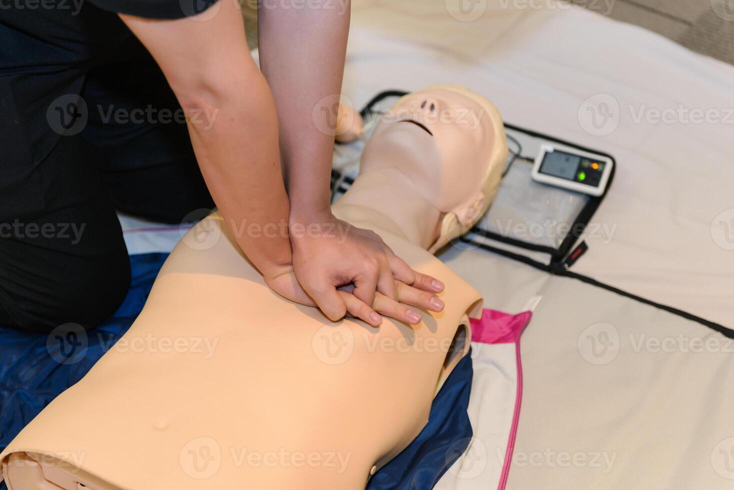 CPR First Aid Training with CPR dummy in the class photo