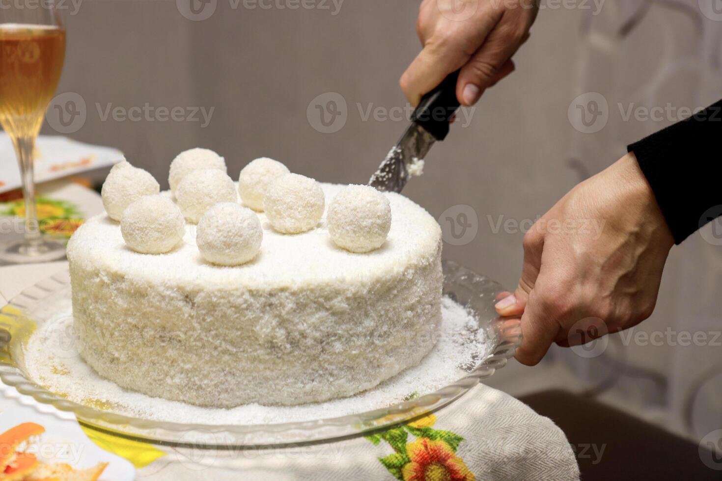 female hands cutting homemade cake photo