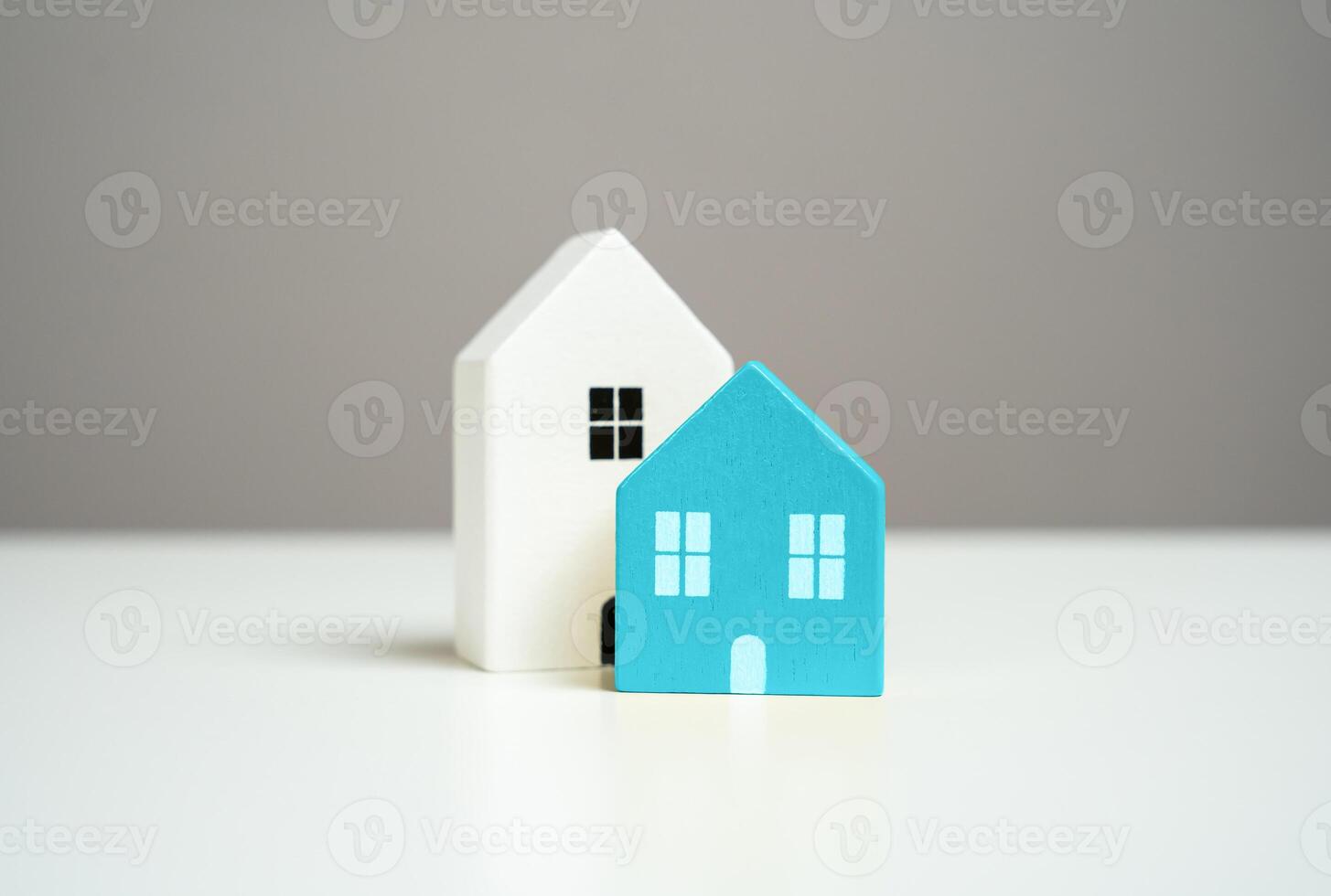 Wooden figures of houses, minimalism. Realtor services. Buying and selling. Housing options. Affordable housing. Mortgage. photo