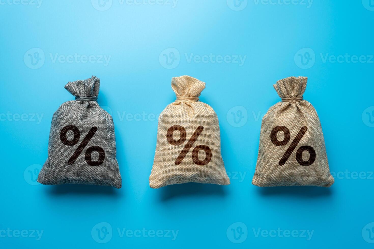 Three bags with percent signs. Discounts, savings or investment. The best conditions for deposits and loans. Banks and banking. photo