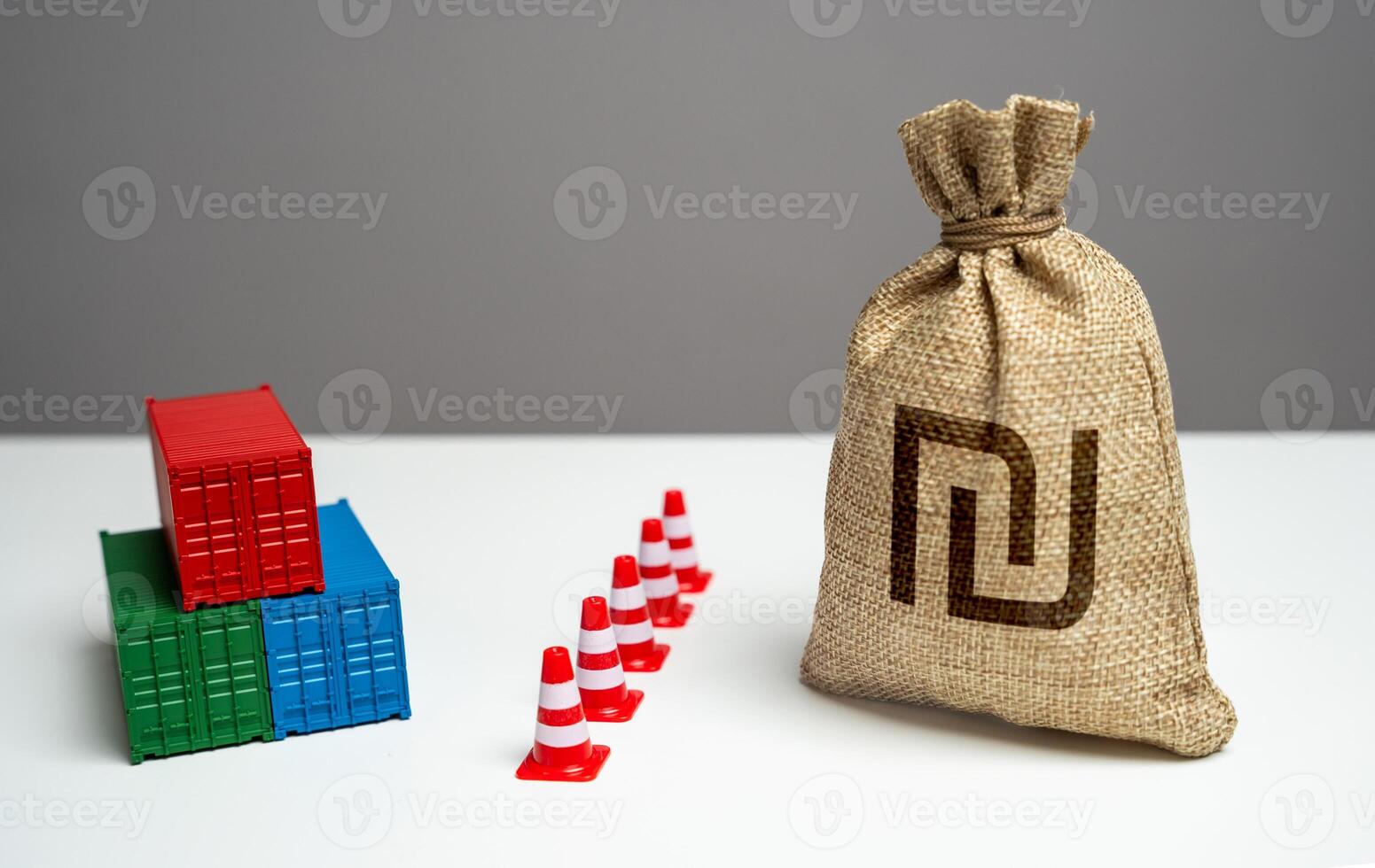 Shipping containers with goods and Israeli shekel money bag are separated by a barrier. Break a trade deal. Economic sanctions. Difficulties in maritime trade. Naval blockade. Logistics difficulties photo