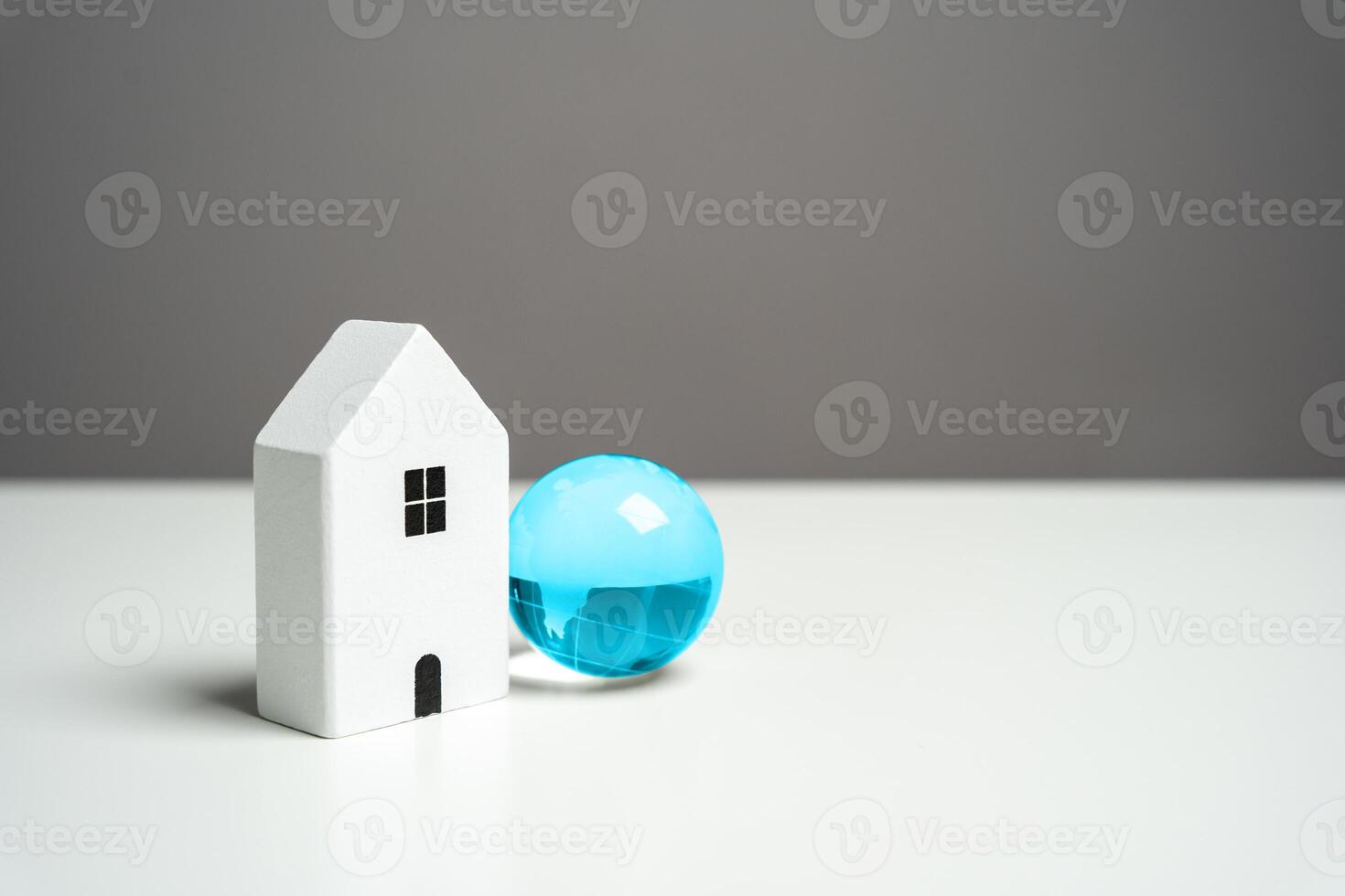 House and blue globe. Internet access concept. Digitally connected home, offering a global gateway to information and communication. photo