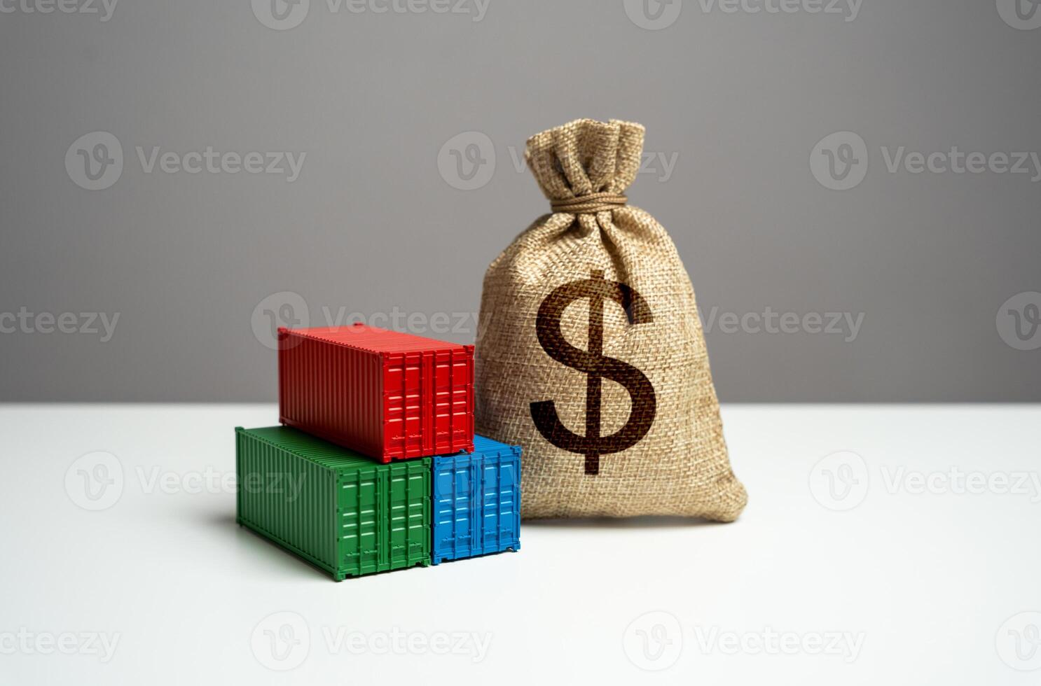 Stack of shipping containers and dollar money bag. Trade, economics and transport industry. GDP and production. Import or export. Tariffs and tax collections. Production of containers. photo