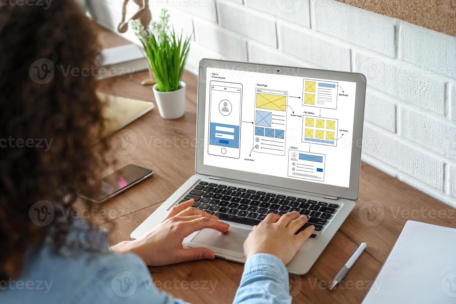 Woman Creating UX UI design process for modish mobile application and website . Creative prototype of wireframe for professional app developer . photo