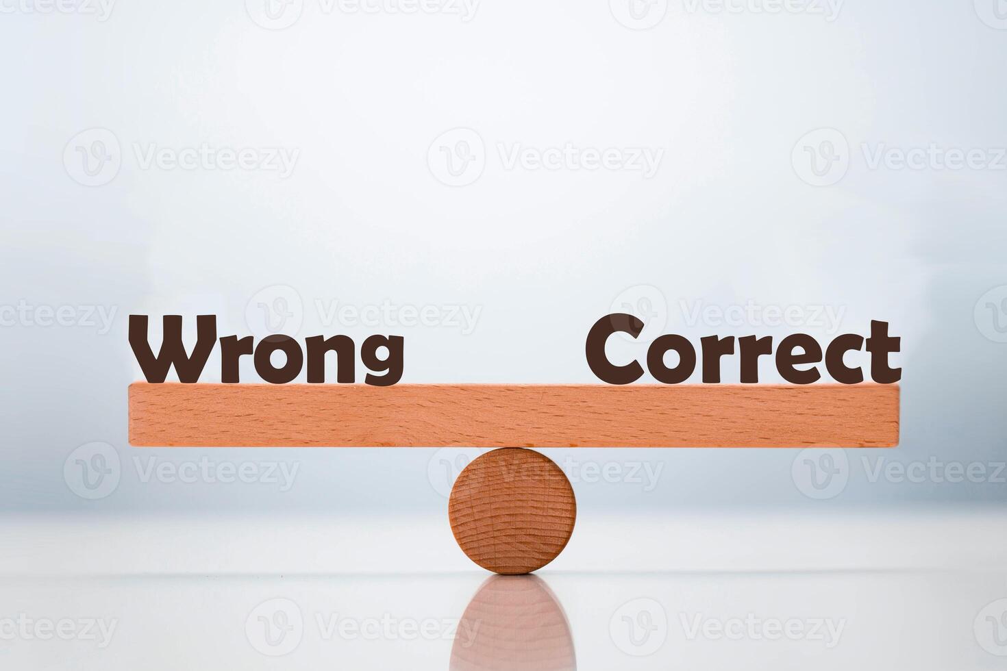 Wrong vs correct word balancing on seesaw choice concept photo