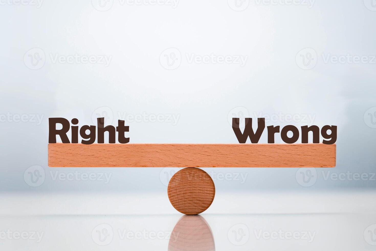 Right vs Wrong word balancing on seesaw choice concept photo