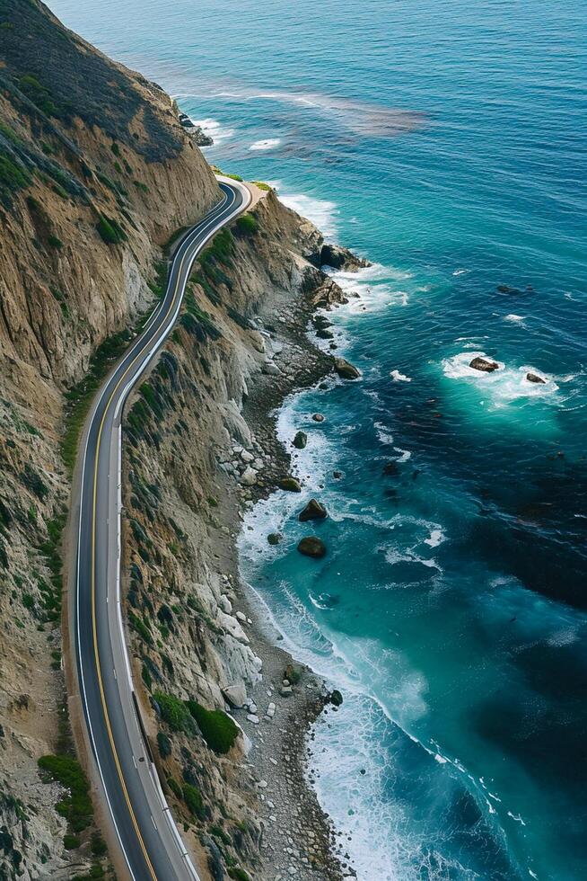 AI generated aerial view captures winding road hugging the coastline. The road is narrow and paved, with visible lane markings Ai Generated photo