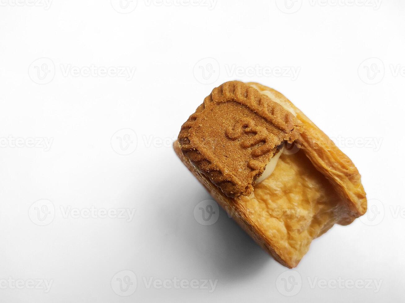 Cromboloni, New York Roll Croissant with biscoff topping, isolated white background. photo