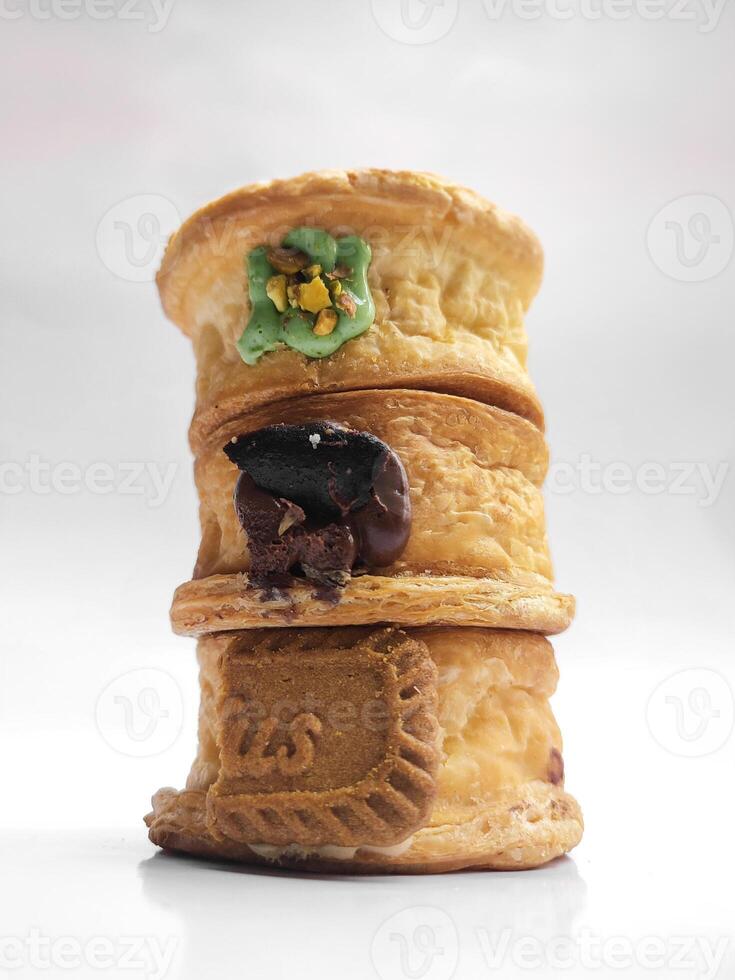 Cromboloni, New York Roll Croissant with a variety of sauce toppings, isolated white background. photo